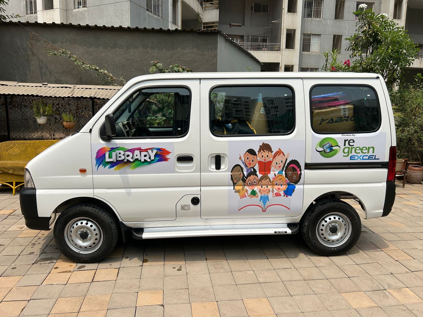 Happy tribal children with mobile library
